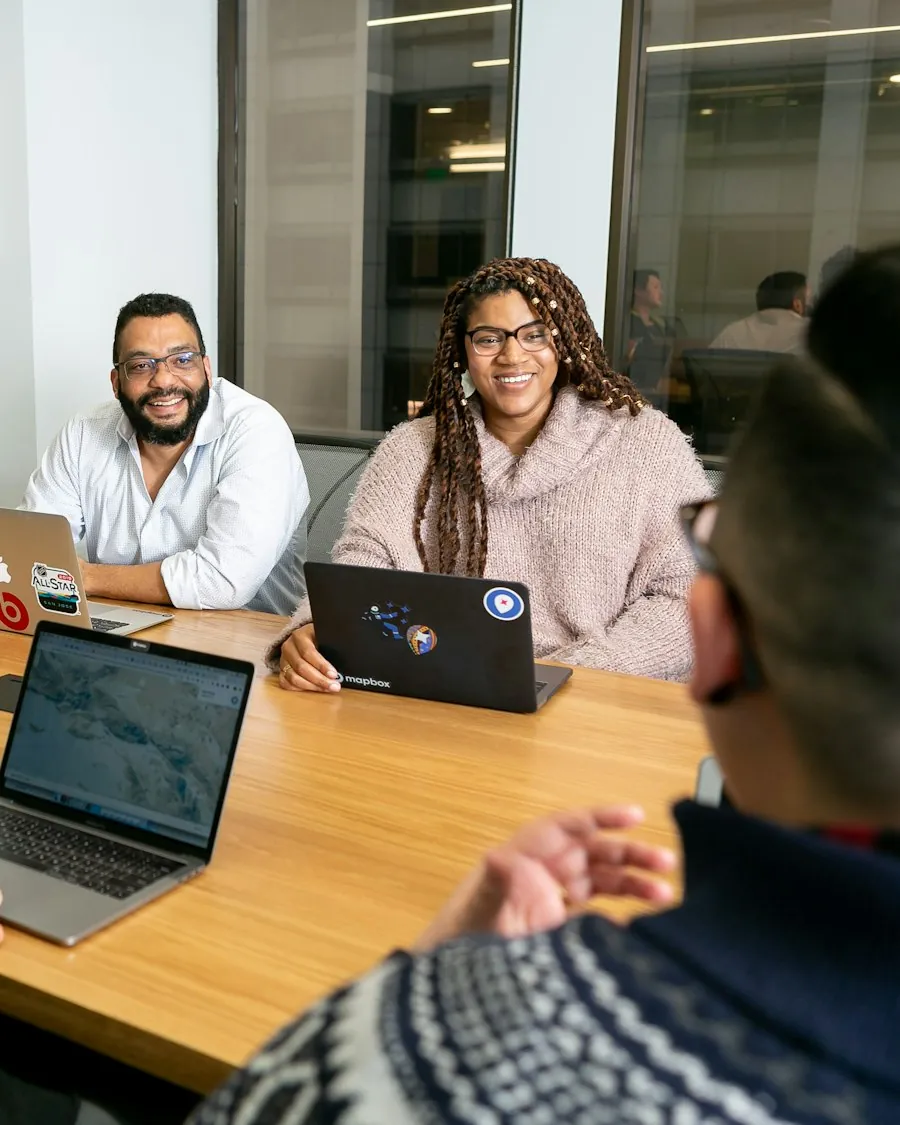DevOps consultants discussing delivery practices with a team